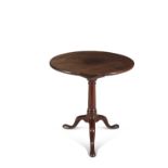 A GEORGE IV MAHOGANY CIRCULAR TILT TOP TEA TABLE, on turned centre pillar and tripod base.