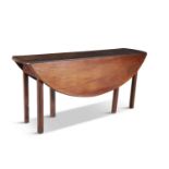 ***WITHDRAWN***A MAHOGANY DOUBLE DROP LEAF HUNT TABLE, extending to oval form, on squared gate