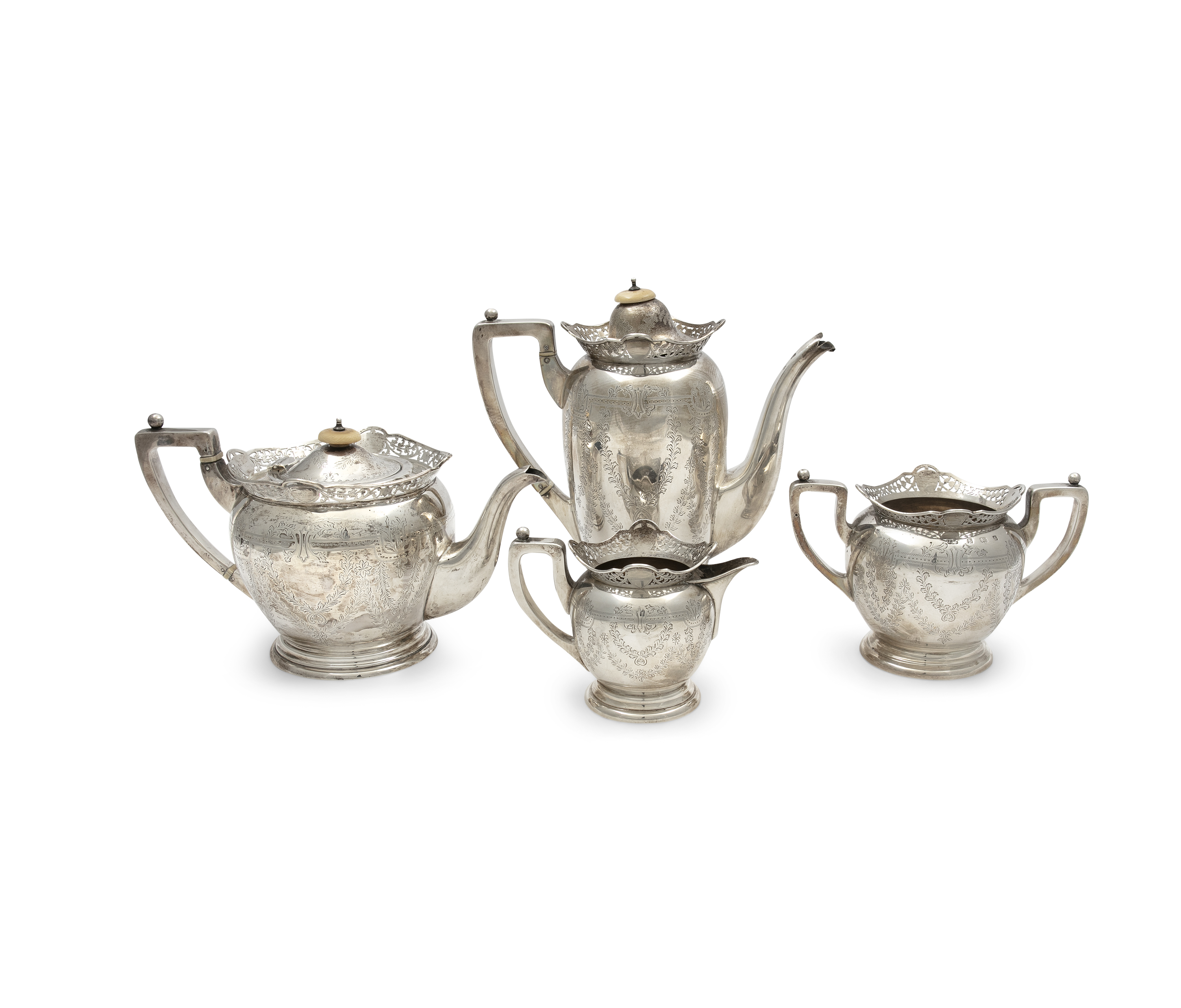 A MATCHED EDWARDIAN FOUR-PIECE TEA AND COFFEE SERVICE, Birmingham, c. 1905/ Sheffield, c. 1920,