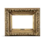 A LATE 19TH CENTURY CARVED GILTWOOD AND GESSO PICTURE FRAME, of rectangular form, with scrolling