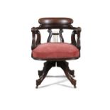 A VICTORIAN MAHOGANY FRAMED TUB BACK SWIVEL CHAIR, with pierced lyre shaped splat and scroll