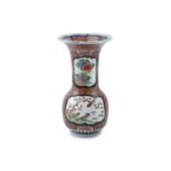 A JAPANESE IMARI PORCELAIN VASE, 19th century, with flared wavy rim and baluster body painted with