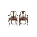 A PAIR GEORGIAN STYLE WALNUT AND CANEWORK ARMCHAIRS, c.1900,, each with arched vase shaped splat