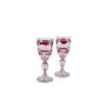 A PAIR OF BOHEMIAN RUBY FLASHED GLASS GOBLETS, 19th century, of circular form, decorated with German