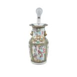 A CANTONESE FAMILLE ROSE PORCELAIN VASE, with figural decoration, fitted as a table lamp. 35.5cm