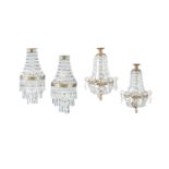 FOUR BRASS FRAMED 'BASKET' WALL SCONCES, with downswept glass beads, with three tiers of hanging