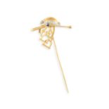 A EQUESTRIAN TIP PIN, composed of a lady's hat highlighted with single-cut diamonds and a circular-