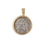 A SILVER AND GOLD MOUNTED PENDANT COIN, 18k, containing a silver tetradrachm , Ptolemaic Kingdom,