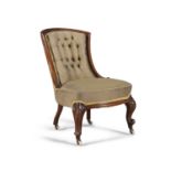 A VICTORIAN WALNUT FRAMED UPHOLSTERED BUTTON BACK ARMCHAIR, raised on cabriole legs