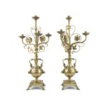 A PAIR OF 19TH CENTURY FRENCH BRASS ECCLESIASTICAL CANDELABRA, each with three scroll branches