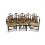 A SET OF TWELVE GEORGE III STYLE MAHOGANY DINING CHAIRS, comprising ten single and two elbow chairs,