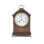AN EDWARDIAN MAHOGANY CASED INLAID BRACKET CLOCK, c.1900, the arched top with raised loop handle,