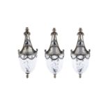 A SUITE OF THREE EDWARDIAN SILVERED AND CUT GLASS CEILING LIGHTS, of ovoid form with neo classical