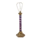 A GILDED BRASS, RUBY AND MARBLEISED FACETED CAMEO GLASS LAMP BASE, c.1830, on hexagonal foliate