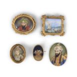 A COLLECTION OF IVORY MINIATURES PORTRAITS, 19th century, comprising three miniatures depicting