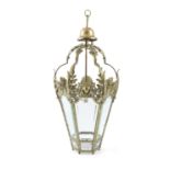 A CAST BRASS FRAMED HEXAGONAL HALL LANTERN, of tapering design, fitted with six bevelled glass