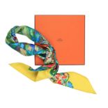 A 'AU COEUR DE LA VIE' SILK SCARF, BY HERMES, of flora and fauna theme, within yellow borders,