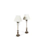 A PAIR OF TABLE LAMPS, the reeded brass columns each with projecting leaves and hanging glass