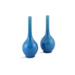 A PAIR OF CHINESE BLUE MONOCHROME BOTTLE VASES, 19th century, each with pear-shaped body and