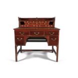 A COMPOSED GEORGE III KNEEHOLE WRITING DESK, with raised superstructure fitted with an arrangement