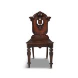 A PAIR OF VICTORIAN MAHOGANY SHIELD BACK HALL CHAIRS, c.1870s, the pierced panel backs set with