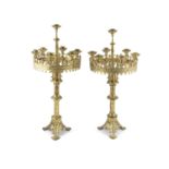 A PAIR OF 19TH CENTURY FRENCH GILT-BRASS SEVEN-LIGHT CHURCH CANDELABRA IN THE GOTHIC TASTE, the