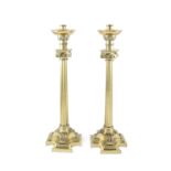 A PAIR OF LARGE 19TH CENTURY BRASS CHURCH CANDLESTICKS, in the form of Corinthian columns, with