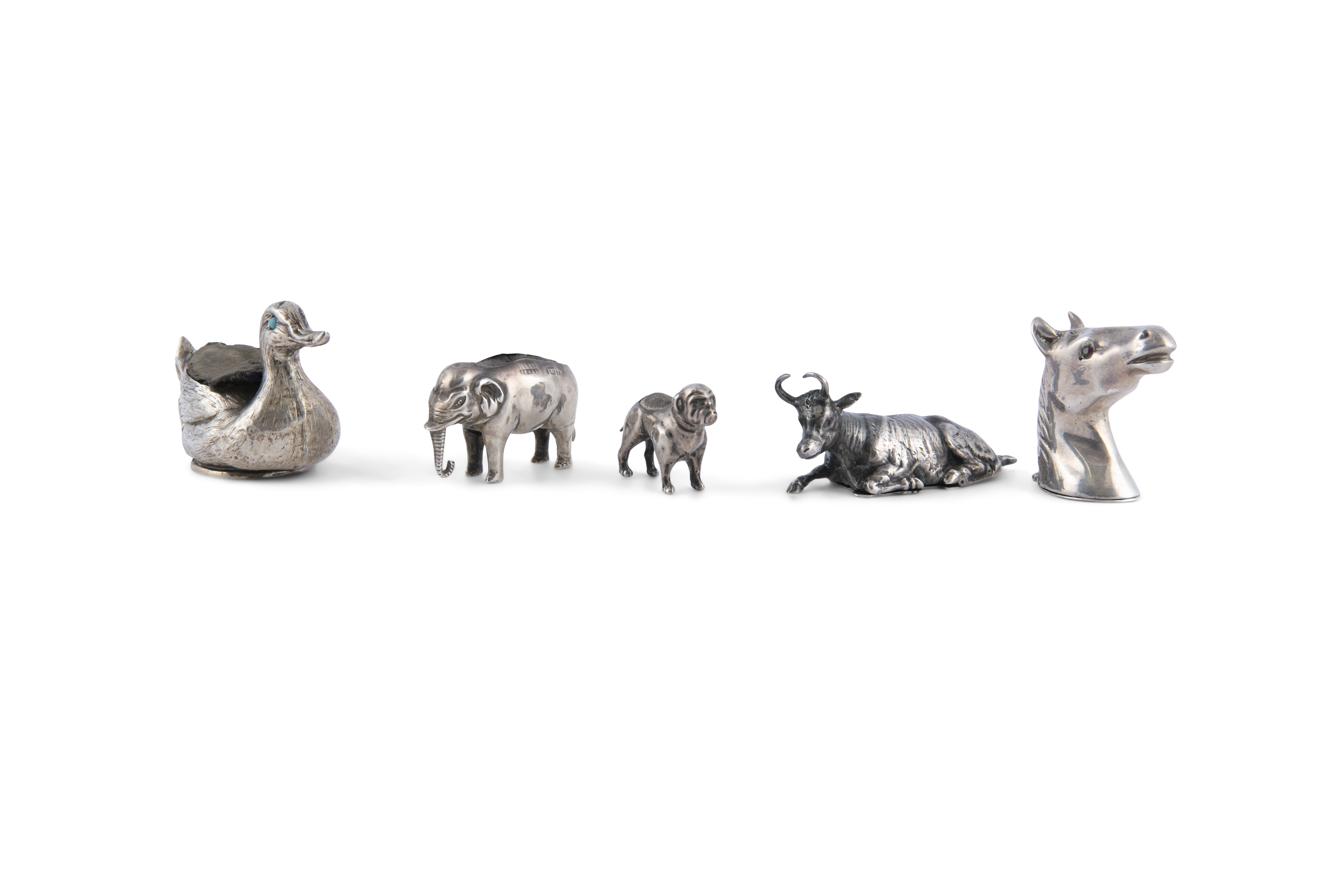 A COLLECTION OF THREE 19TH CENTURY SILVER PIN CUSHIONS, naturalistically formed as a bulldog, a swan