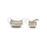 AN IRISH GEORGE III SILVER SUGAR BOAT AND CREAM JUG, Dublin 1805/1806, markers marks rubbed, each of