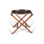 ***PLEASE NOTE DESCRIPTION SHOULD READ*** AN OVAL MAHOGANY BUTLER'S TRAY ON A FOLDING STAND, the t