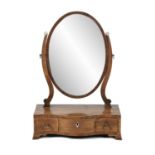 A GEORGE III INLAID MAHOGANY SERPENTINE FRONT TOILET MIRROR, with crutch frame oval mirror plate