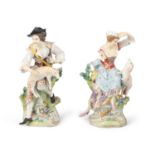 A PAIR OF GERMAN PORCELAIN GROUPS, in 18th century style, of a shepherd and shepherdess with their