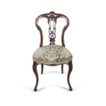 A VICTORIAN ROSEWOOD FRAMED SALON CHAIR, with pierced splat back, upholstered padded seat and raised