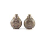 A PAIR OF AESTHETIC PERIOD MOON FLASKS, c.1880, in imitation of the Chinese originals, with