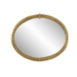 A LARGE GILTWOOD AND GESSO OVAL MIRROR, 19th century, the plain glass plate within a border of