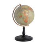 A PHILIPS 9 TERRESTRIAL GLOBE, early 20th century, supported on an engraved brass arc, and turned