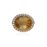 A VICTORIAN CITRINE AND SEED PEARL BROOCH The oval-shaped citrine within collet-setting to a