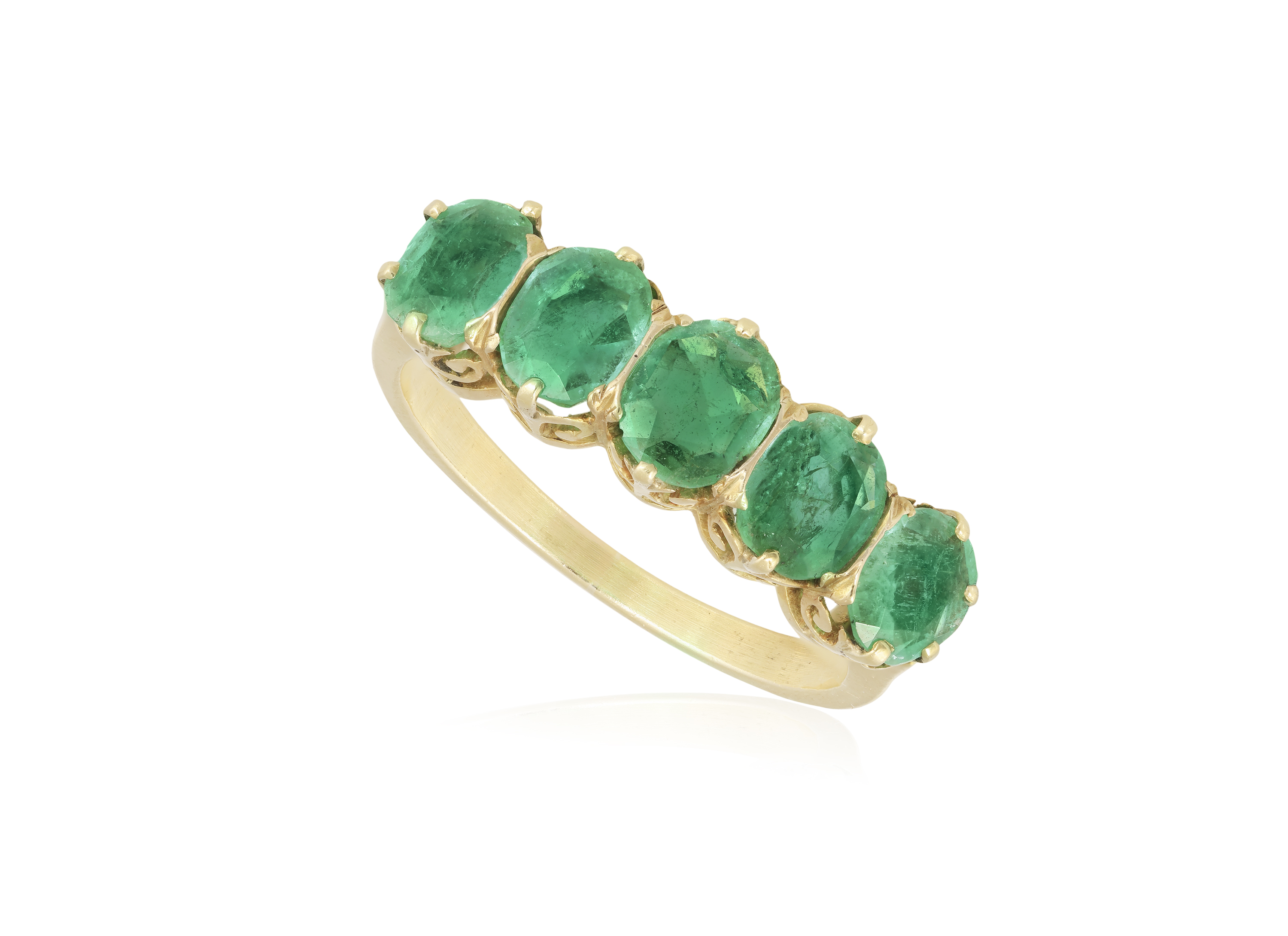 AN EMERALD FIVE-STONE RING Set with a graduated row of oval-shaped emeralds with claw-setting, to