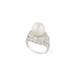 AN EARLY 20TH CENTURY PEARL AND DIAMOND RING, CIRCA 1920 The central round-shaped pearl of white