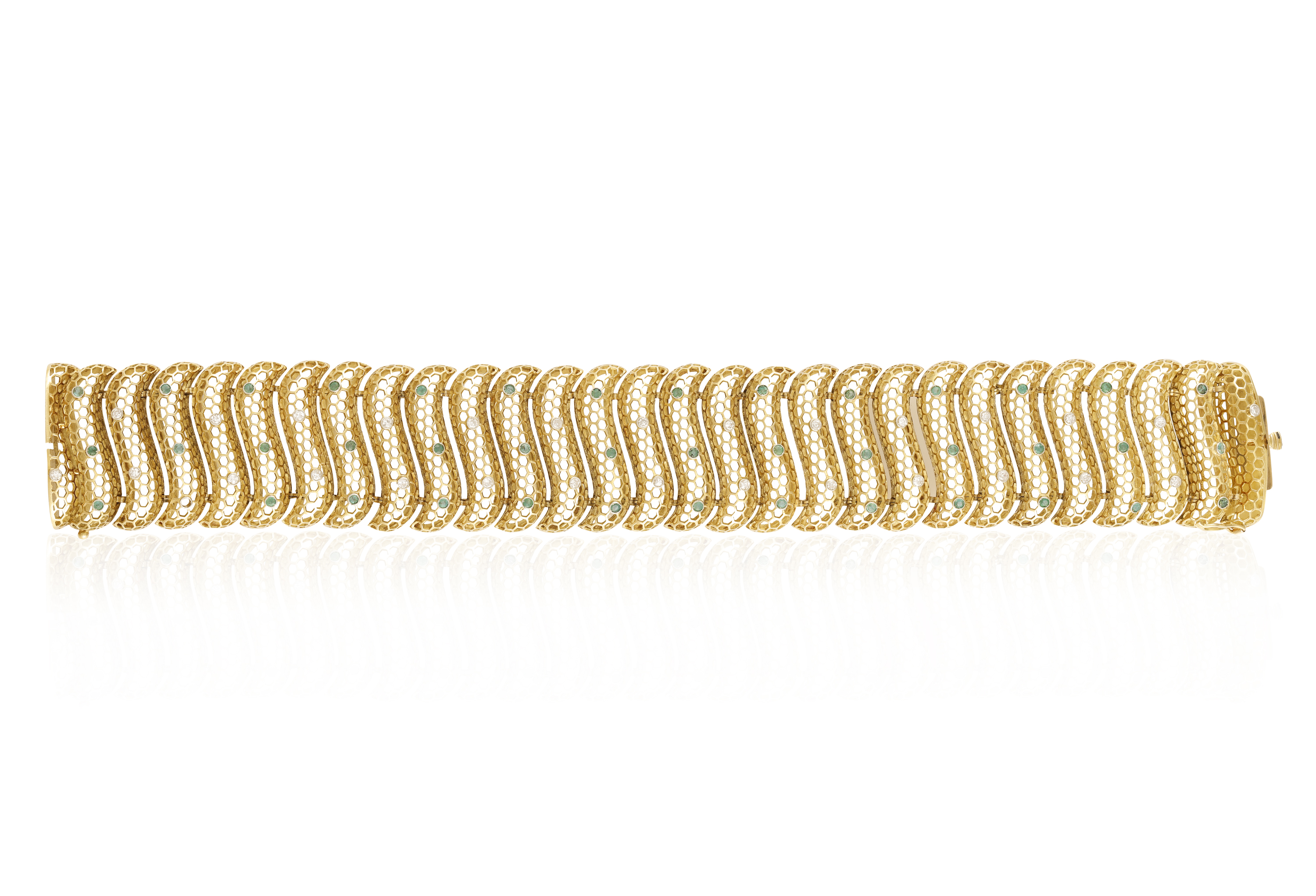 AN EMERALD AND DIAMOND BRACELET, CIRCA 1960 Composed of continuous bombé S-shaped links with