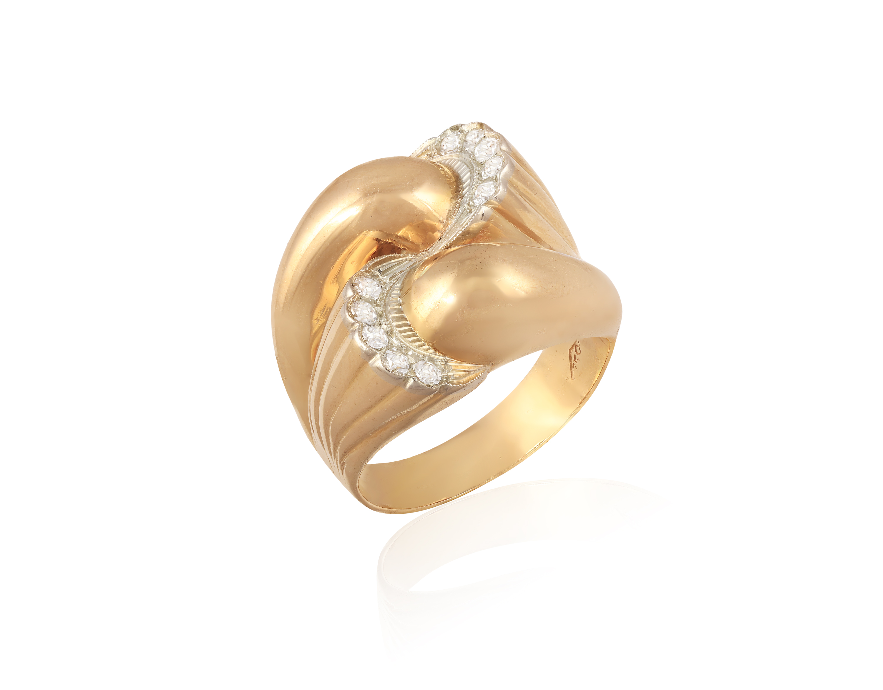 A RETRO DIAMOND COCKTAIL RING, CIRCA 1950 Of bombé design, the reeded terminals embellished with