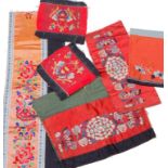 Lote de seis ornamentos en seda de vestidos en tonos rojizos. China, S. XIX