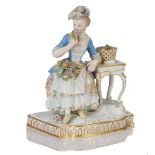 Dama con cesto de flores en porcelana esmaltada.Meissen, (1860-1924)