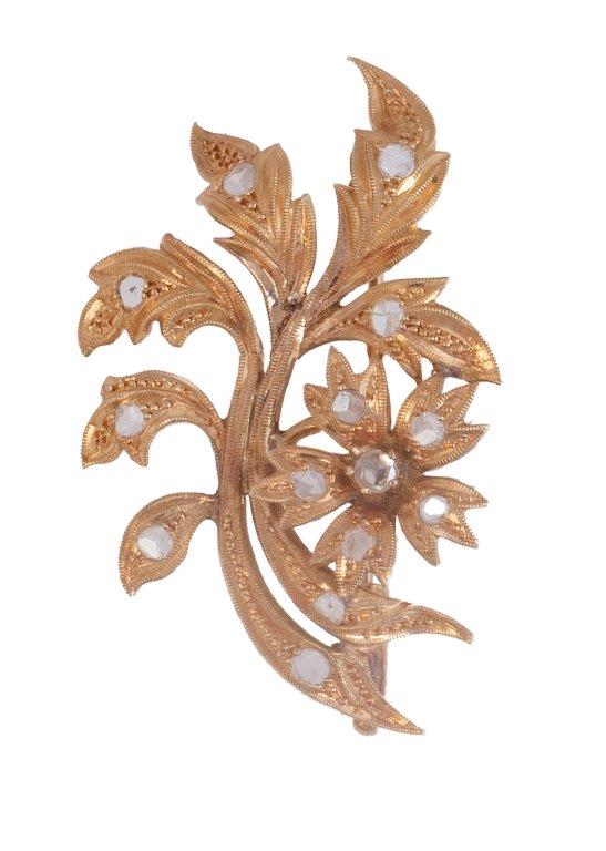 Broche S. XIX de diamantes con diseño de rama con flor y hojas