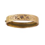 Brazalete rígido S. XIX con flores de diamantes en aro liso de metal dorado