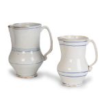 Dos jarros de cerámica esmaltadas en blanco con líneas azul cobalto.Manises, S. XIX.