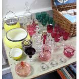 A heavy cut-glass mallet-shaped decanter, a set of six drinking vessels with cranberry glass