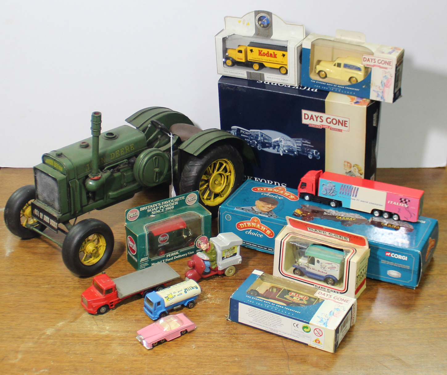 A reproduction tinplate model of a “John Deere” tractor; & approximately twenty various other