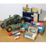 A reproduction tinplate model of a “John Deere” tractor; & approximately twenty various other