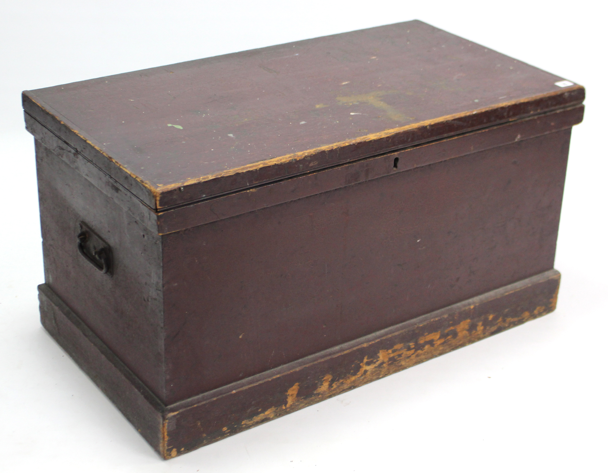 A Victorian painted pine storage trunk with hinged lift-lid, wrought-iron side handles, & on